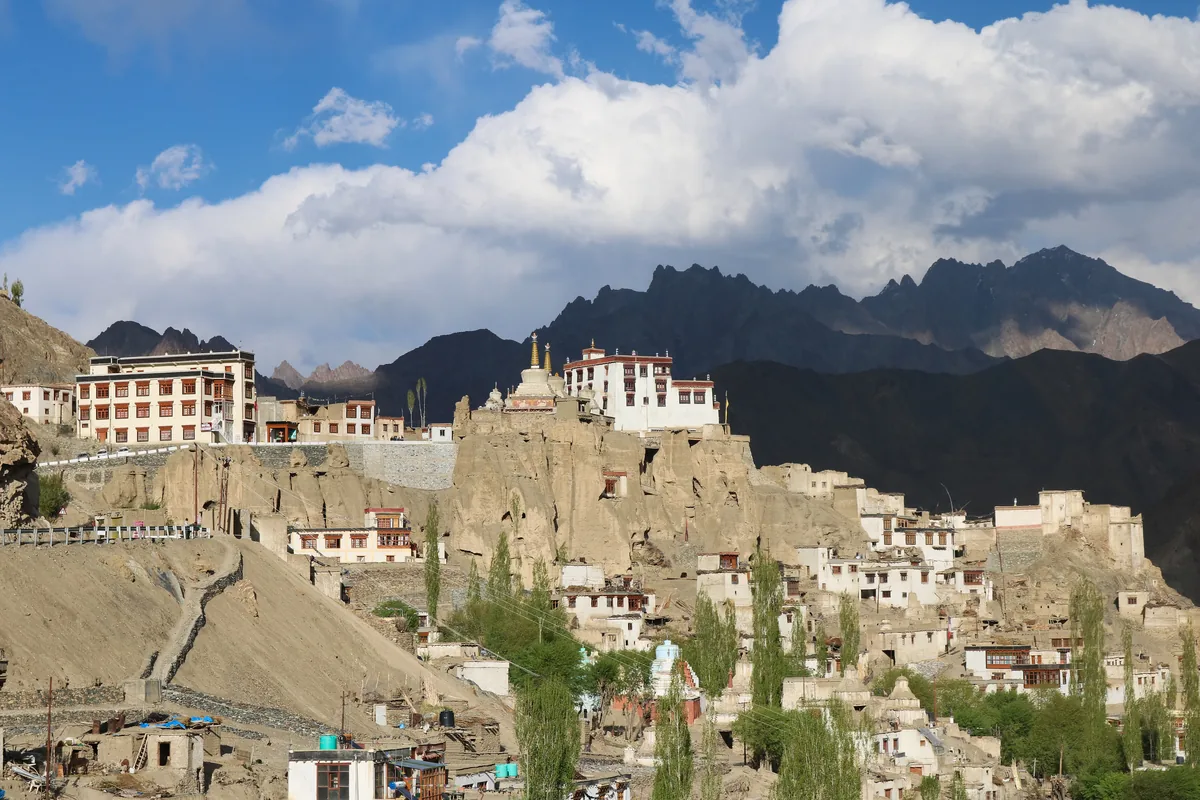 Lamayuru Monastery perched on sedimentary rock formations above the Moonland geological terrain on Srinagar-Leh highway