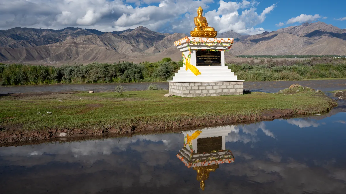Sacred Buddha statue and riverside promenade at Sindhu Ghat along the Indus River in Shey Ladakh