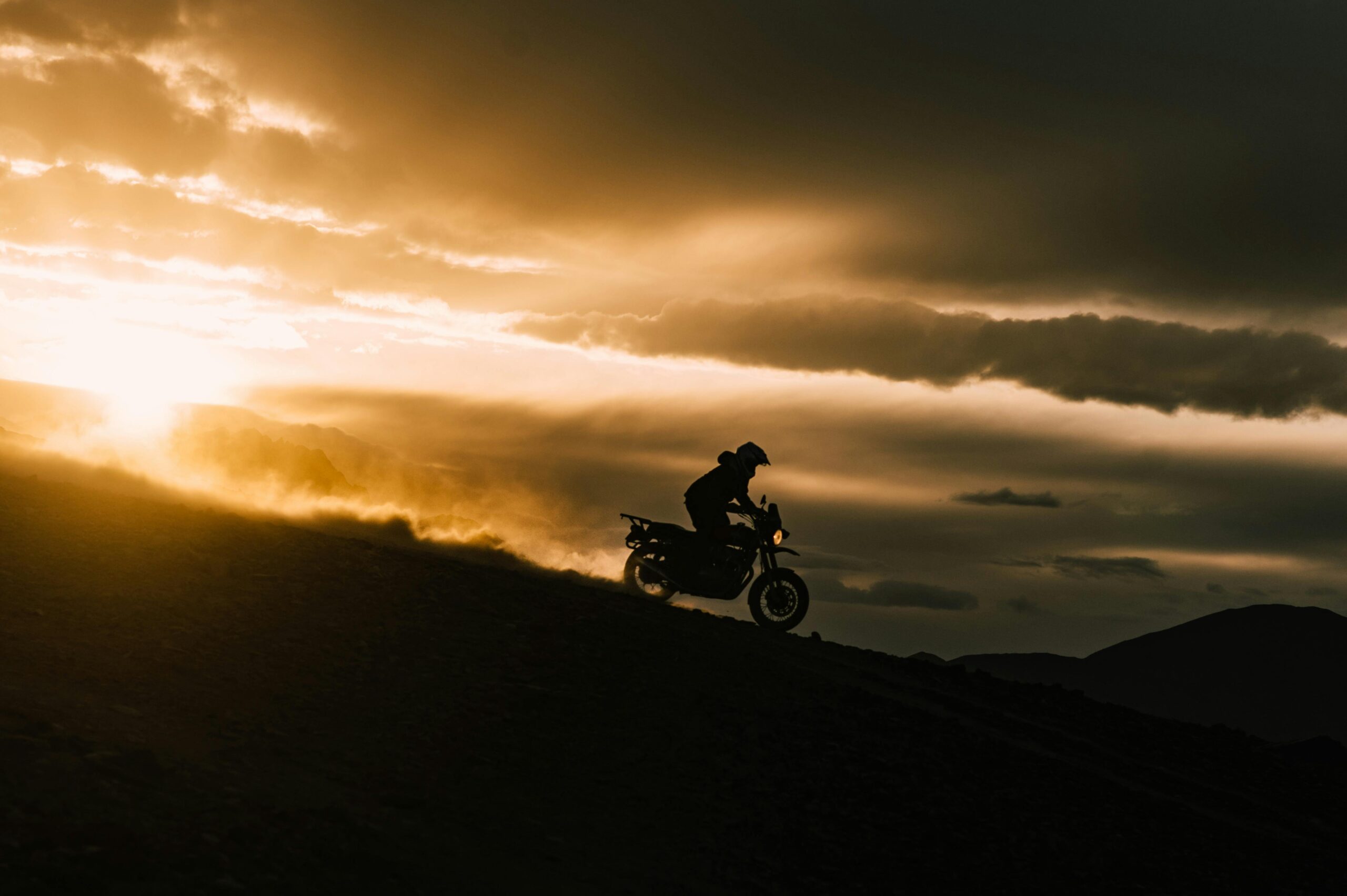 adventurous biker riding in the evening while visiting ladakh